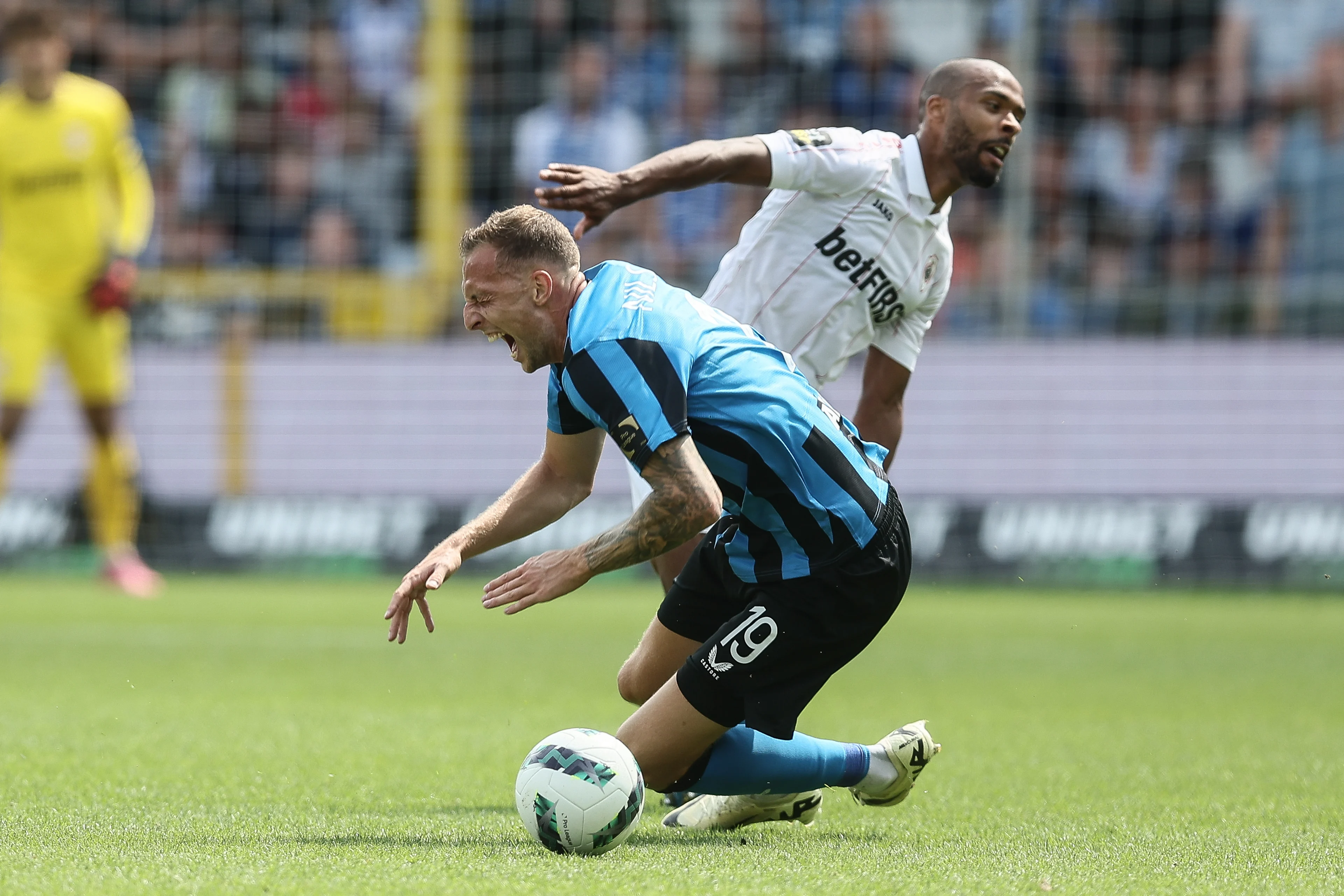 Club's Gustaf Nilsson and Antwerp's Denis Odoi fight for the ball during a soccer match between Club Brugge KV and Royal Antwerp FC, Sunday 18 August 2024 in Brugge, on the day four of the 2024-2025 season of the 'Jupiler Pro League' first division of the Belgian championship. BELGA PHOTO BRUNO FAHY