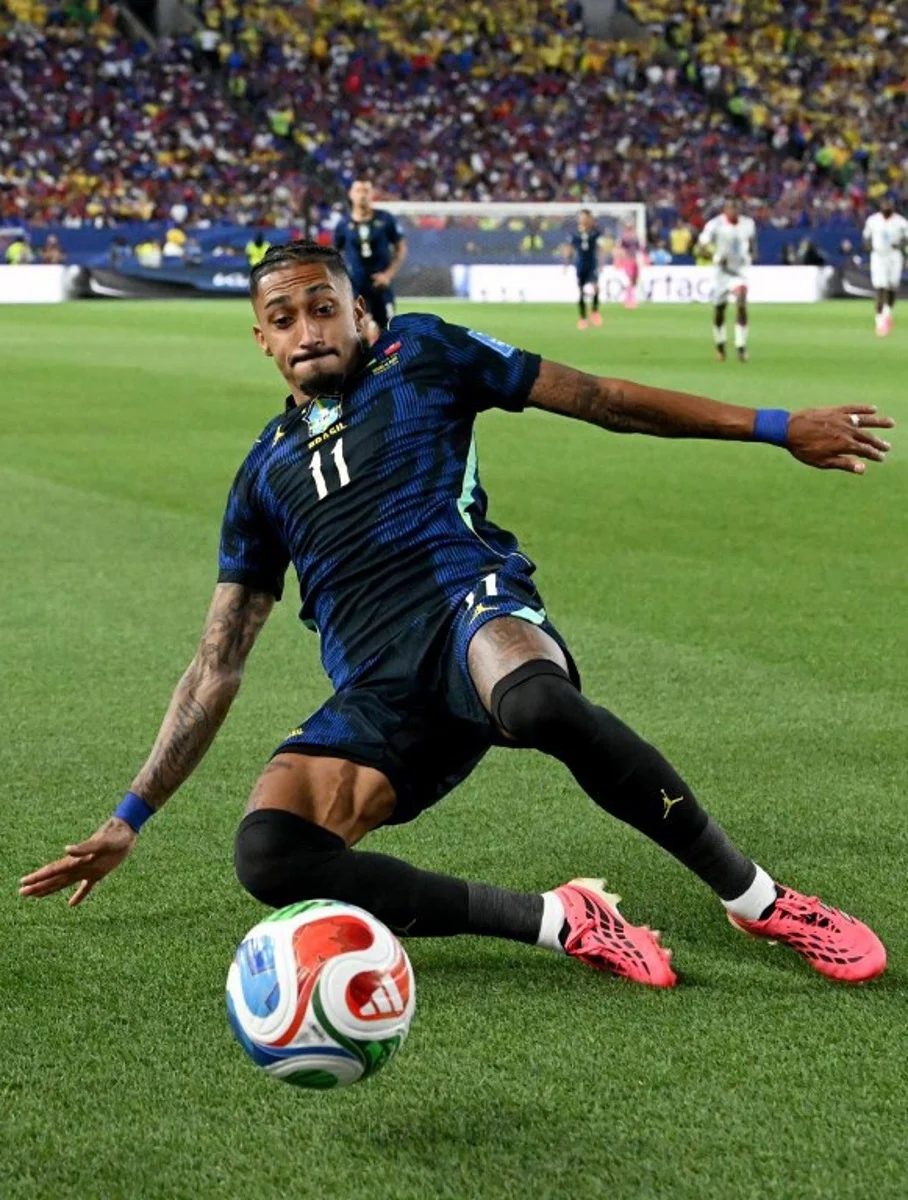 Brazil's forward #11 Raphinha slides for the ball during the 2026 World Cup Group C football match between Brazil and Haiti at the Philadelphia Stadium in Philadelphia on June 19, 2026.   ROBERTO SCHMIDT / AFP
