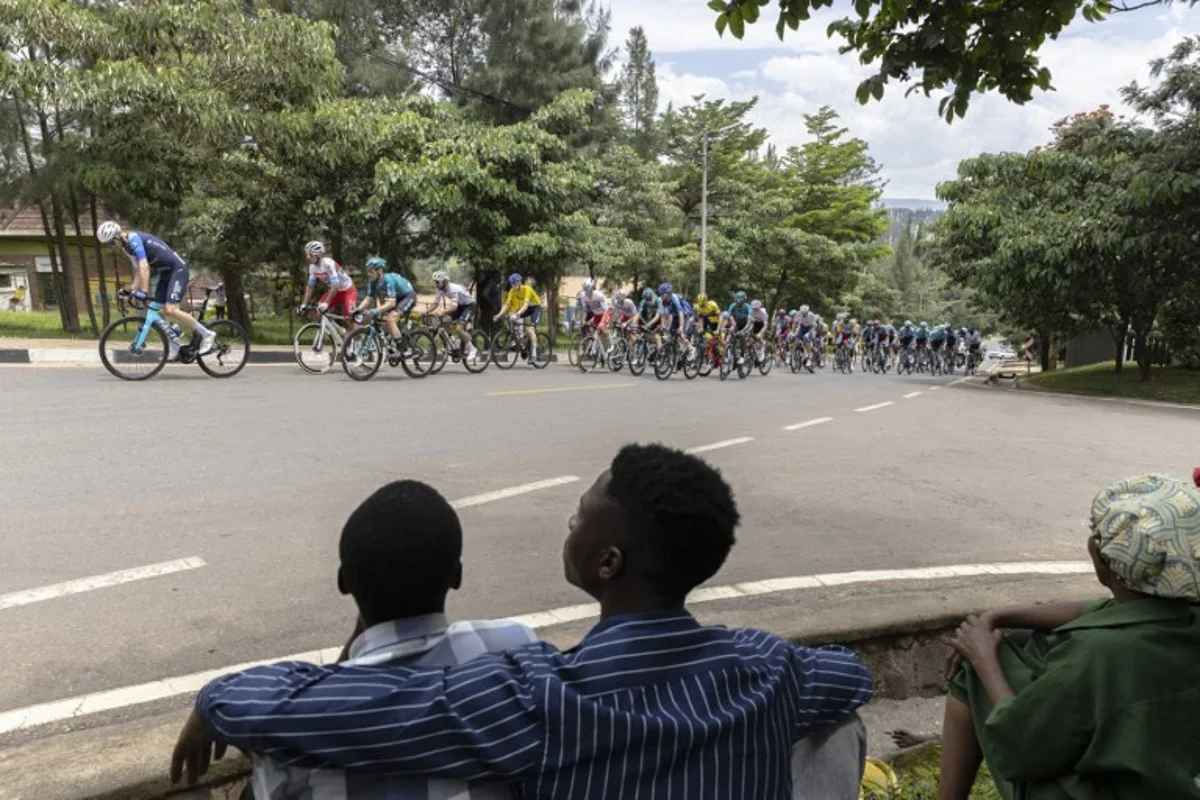 The pack rides during the last stage of the 16th Tour du Rwanda in Kigali on February 25, 2024.  Guillem Sartorio / AFP