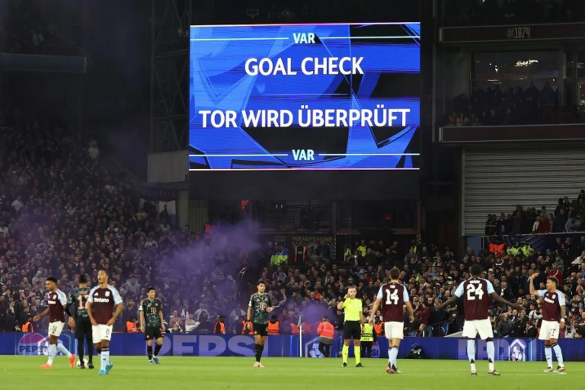 Aston Villa's Spanish defender #14 Pau Torres looks to the screen as a VAR review into his goal takes place, revealing he was offside, and consequently discounting the goal, during the UEFA Champions League league stage football match between Aston Villa and Bayern Munich at Villa Park in Birmingham, central England on October 2, 2024.  Darren Staples / AFP