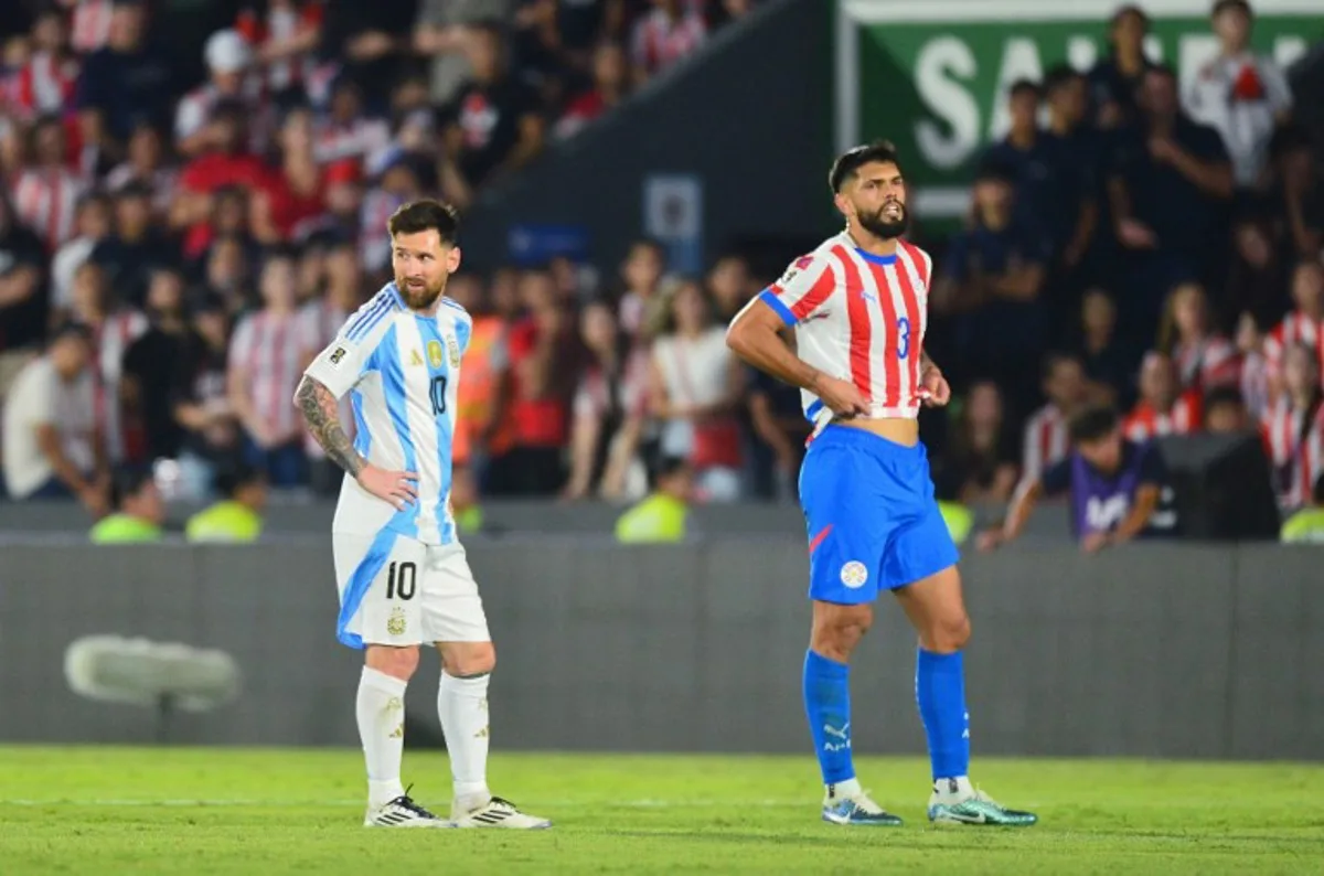 Argentina's forward #10 Lionel Messi and Paraguay's defender #03 Omar Alderete react during the 2026 FIFA World Cup South American qualifiers football match between Paraguay and Argentina at the Ueno Defensores del Chaco stadium in Asuncion on November 14, 2024.  Daniel Duarte / AFP