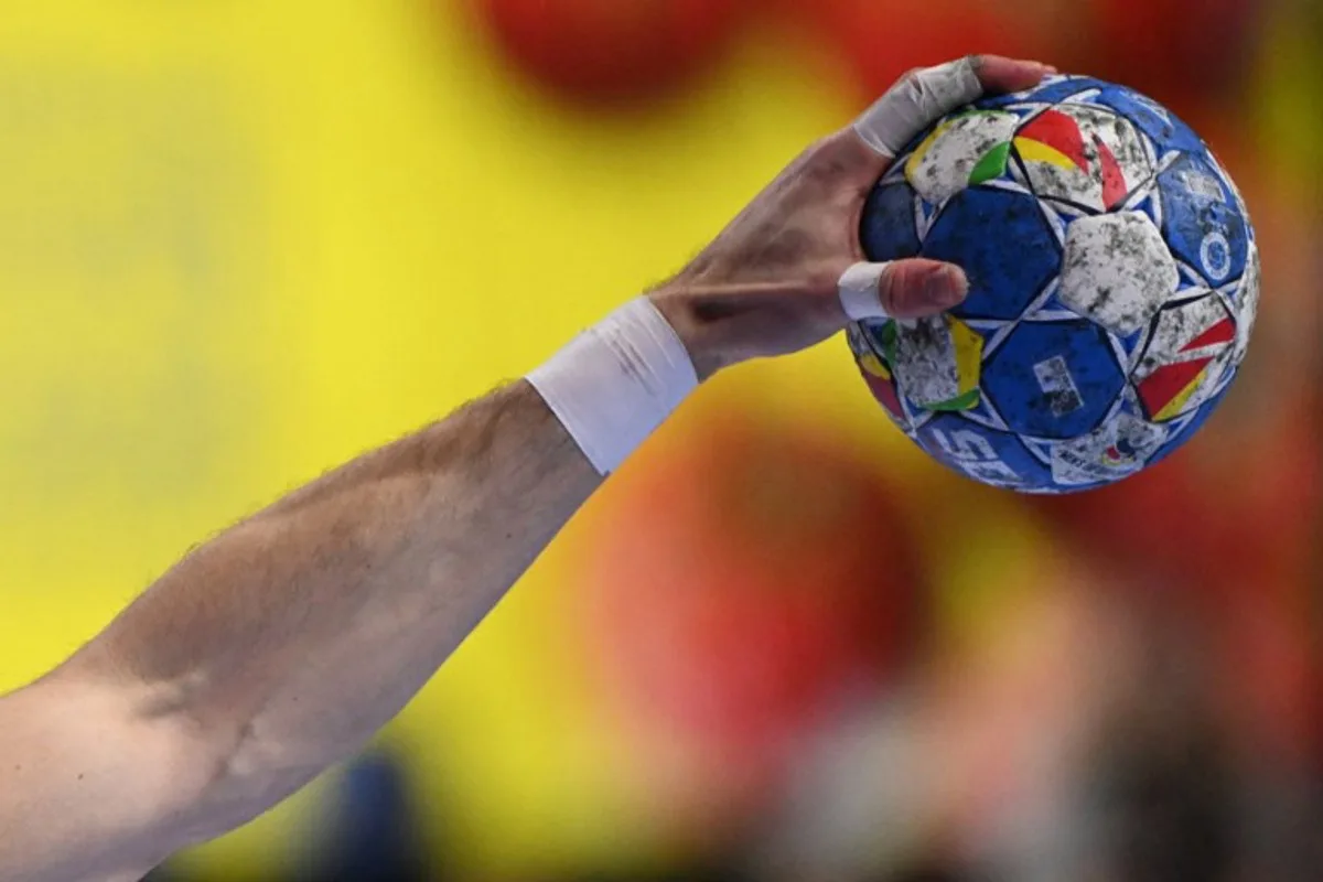 Germany's right back #25 Kai Haefner plays the ball during the Men's EURO 2024 EHF Handball European Championship match for third place between Sweden and Germany in Cologne, western Germany on January 28, 2024.  Kirill KUDRYAVTSEV / AFP