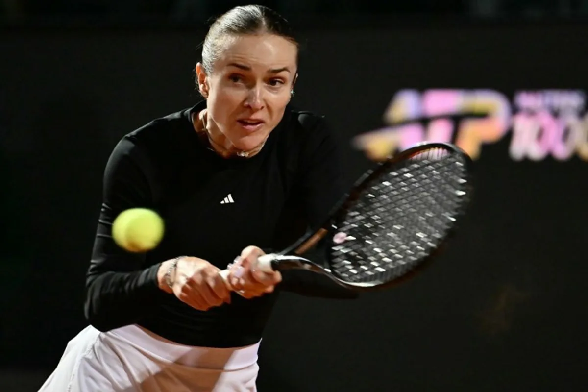 Ukraine's Elina Svitolina hits a return to Poland's Iga Swiatek during the WTA Rome Open tennis tournament at Foro Italico in Rome on May 14, 2026. Filippo MONTEFORTE / AFP