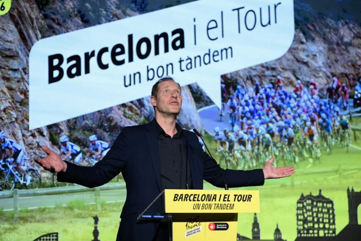 Tour de France general director Christian Prudhomme gestures during a ceremony in Barcelona to present the start of the 2026 Tour de France cylcling race from Barcelona, on February 25, 2025. The 2026 Tour de France cycling race's Grand Depart first stage will be held in Barcelona on July 4, 2026 with Spain's north eastern Catalonia region also hosting the second and third stages of La Grand Boucle. Josep LAGO / AFP