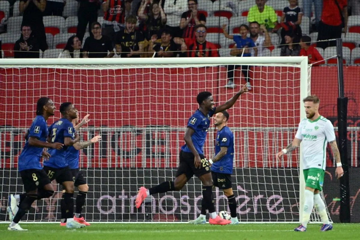 Nice's French forward #25 Mohamed-Ali Cho (C) celebrates after scoring  his team's third goal   during the French L1 football match between OGC Nice and AS Saint-Etienne at the Allianz Rivera stadium in Nice, south-eastern France, on September 20, 2024.   Christophe SIMON / AFP