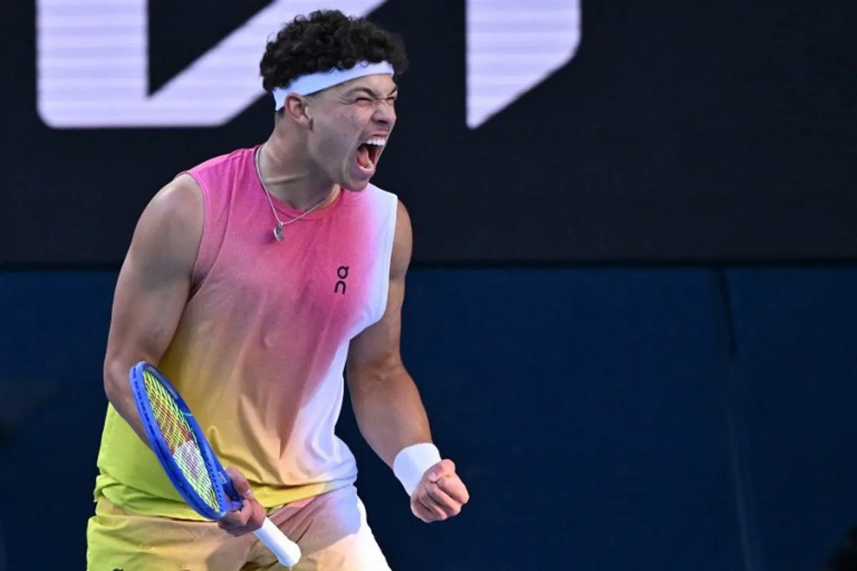 USA's Ben Shelton reacts after a point against Italy's Lorenzo Sonego during their men's singles quarter-final match on day eleven of the Australian Open tennis tournament in Melbourne on January 22, 2025.  WILLIAM WEST / AFP