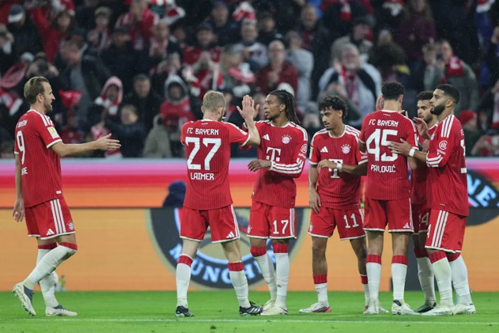Bayern Munich's French midfielder #17 Michael Olise (3rd L) celebrates scoring the 3-0 goal with his teammates during the German first division Bundesliga football match between FC Bayern Munich and RB Leipzig in Munich, southern Germany, on October 17, 2026. Alexandra BEIER / AFP