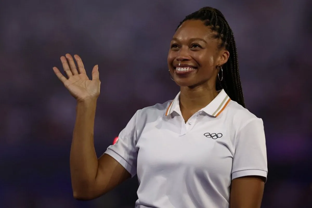 US' athlete Allyson Felix waves as she is presented by Paris 2024 Olympians as a new member of the IOC Athletes' Commission during the closing ceremony of the Paris 2024 Olympic Games at the Stade de France, in Saint-Denis, in the outskirts of Paris, on August 11, 2024.  Franck FIFE / AFP