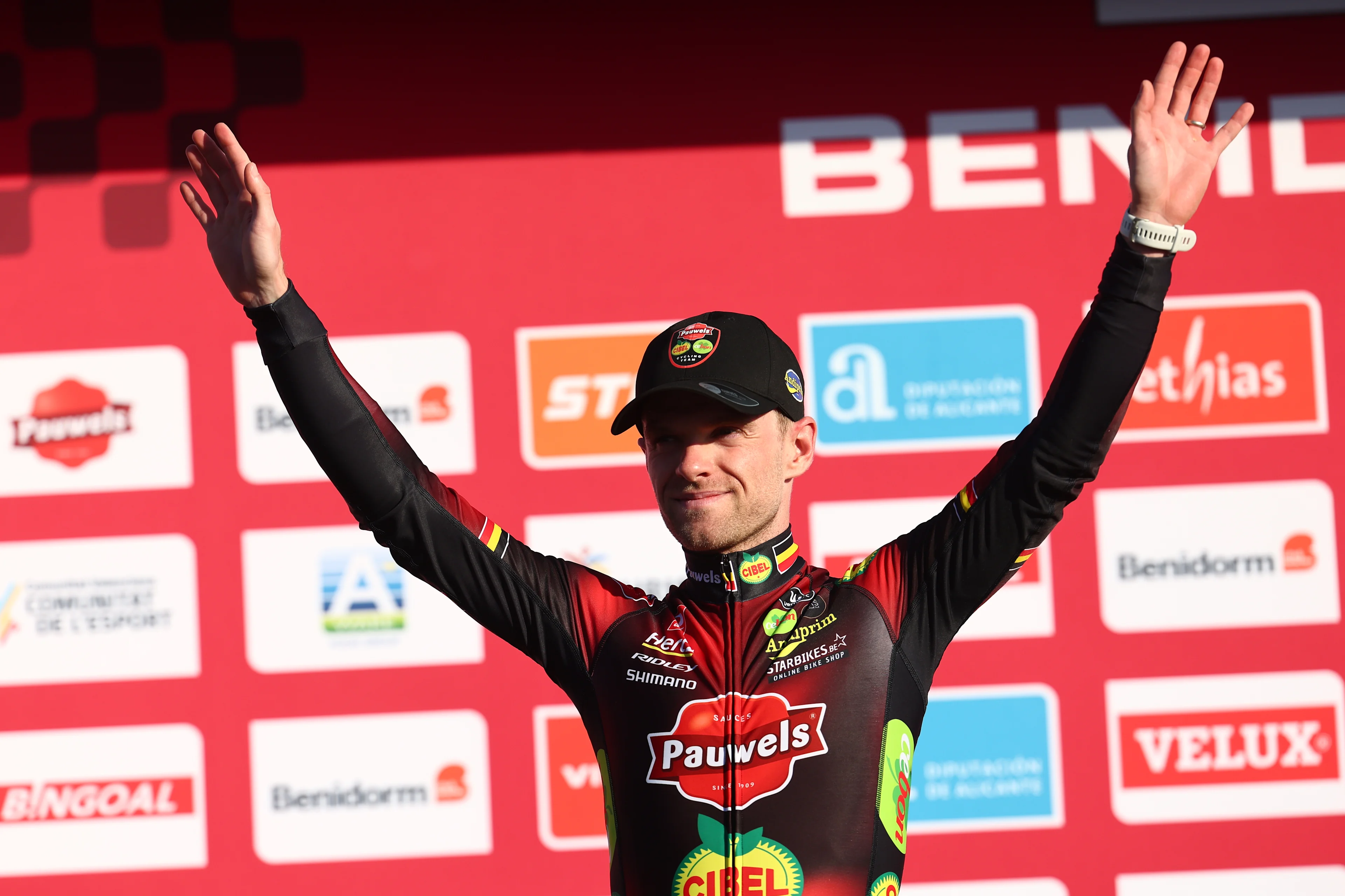 Second placed Belgian Eli Iserbyt celebrates on the podium of the men's elite race at the cyclocross cycling event in Benidorm, Spain, Sunday 19 January 2025, stage 12/14 in the UCI World Cup competition. BELGA PHOTO DAVID PINTENS