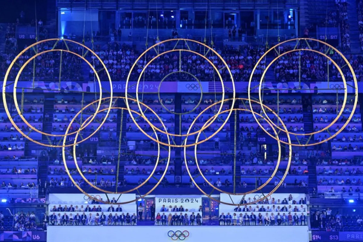 The Olympic rings are displayed during the closing ceremony of the Paris 2024 Olympic Games at the Stade de France, in Saint-Denis, in the outskirts of Paris, on August 11, 2024.  MOHD RASFAN / AFP