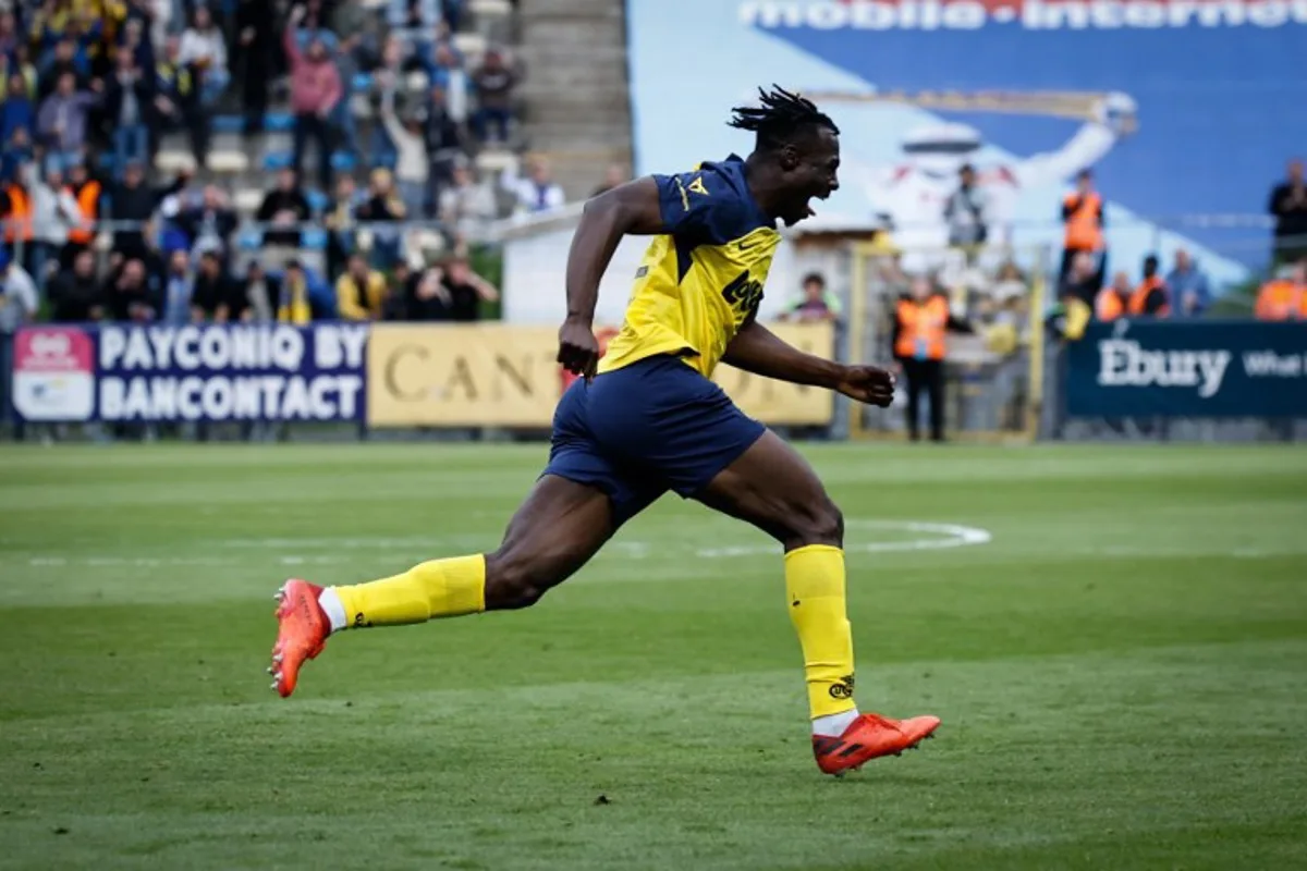Union's Canada forward #12 Promise David celebrates after scoring a goal during the Belgian Pro League champions' play-off football match (day 10 of 10) between Royale Union Saint-Gilloise and KAA Gent, at the Joseph Marien Stadium in Brussels, on May 25, 2025. Simon Wohlfahrt / AFP