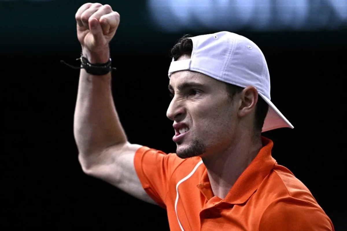 France's Ugo Humbert celebrates after a point as he plays against Spain's Carlos Alcaraz during their men's singles round of 16 match on day four of the Paris ATP Masters 1000 tennis tournament at the Accor Arena - Palais Omnisports de Paris-Bercy - in Paris on October 31, 2024.  JULIEN DE ROSA / AFP