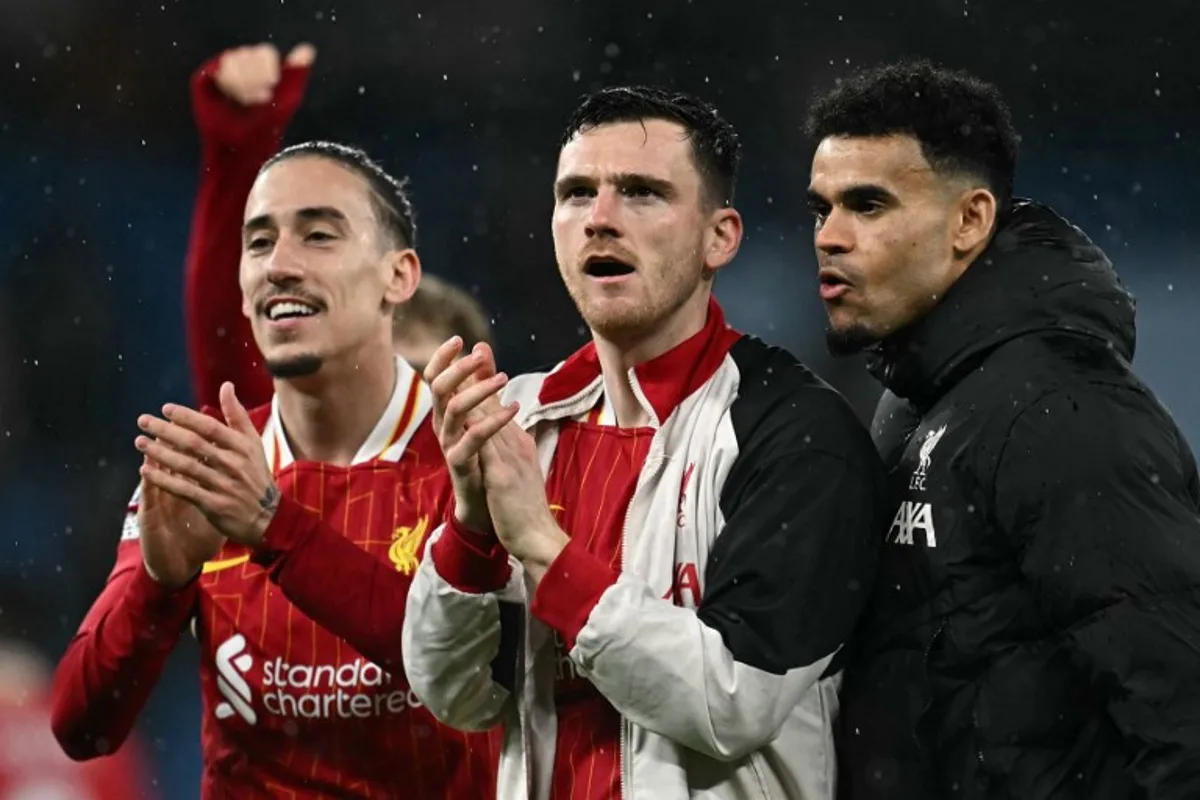 Liverpool's Greek defender #21 Kostas Tsimikas (L), Liverpool's Scottish defender #26 Andrew Robertson (C) and Liverpool's Colombian midfielder #07 Luis Diaz celebrate after the English Premier League football match between Manchester City and Liverpool at the Etihad Stadium in Manchester, north west England, on February 23, 2025.  Paul ELLIS / AFP