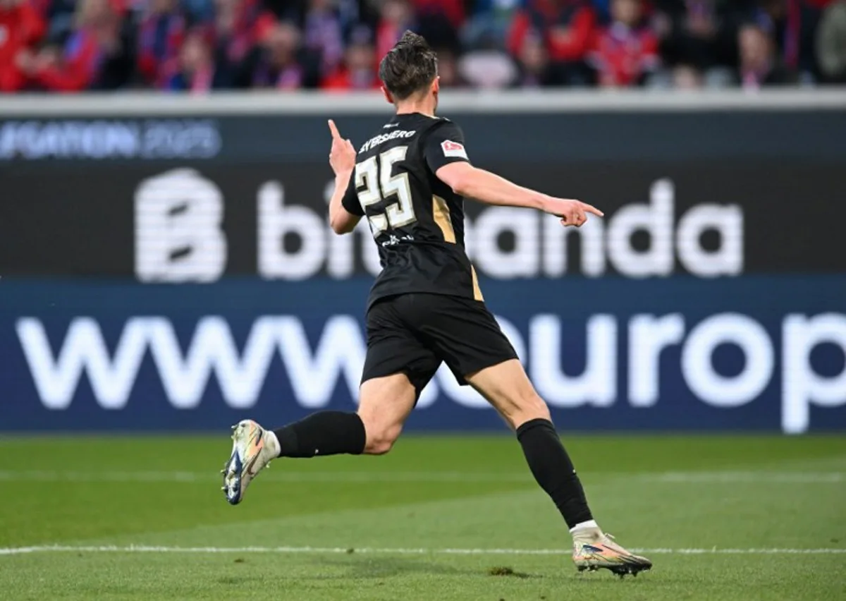 Elversberg's German midfielder #25 Lukas Petkov celebrates scoring the opening goal during the German Bundesliga relegation first-leg football match  between FC Heidenheim and SV Elversberg in Heidenheim on May 22, 2025.  THOMAS KIENZLE / AFP