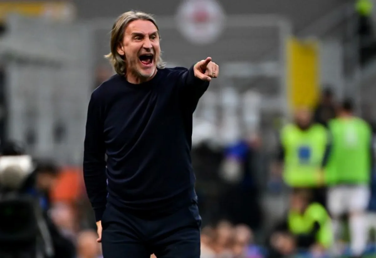 Cagliari's Italian coach Davide Nicola reacts during the Italian Serie A football match between Inter Milan and Cagliari at San Siro stadium in Milan, Italy on April 12, 2025.  Piero CRUCIATTI / AFP
