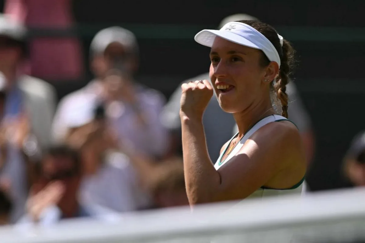 Belgium's Elise Mertens celebrates winning against Kazakhstan's Elena Rybakina during their women's singles third round tennis match on the sixth day of the 2026 Wimbledon Championships at The All England Lawn Tennis and Croquet Club in Wimbledon, southwest London, on July 4, 2026. Glyn KIRK / AFP