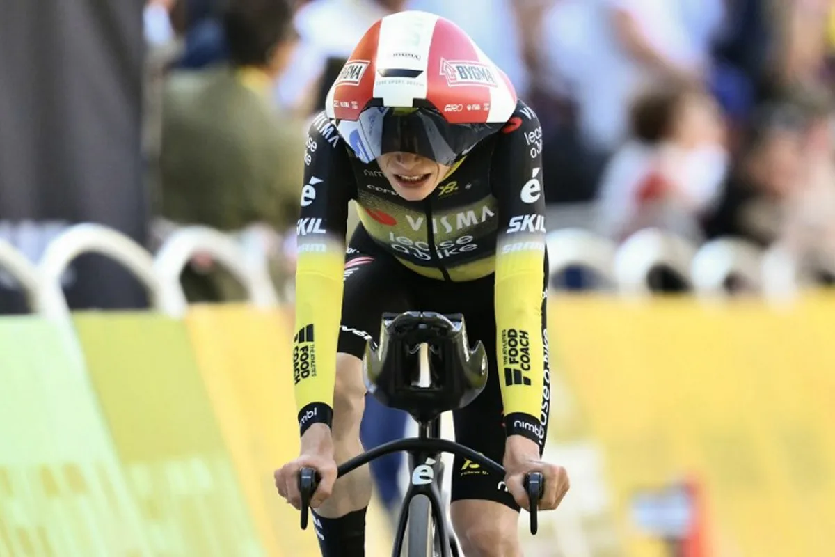 Team Visma - Lease a bike team's Danish rider Jonas Vingegaard cycles to the finish line of the 5th stage of the 112th edition of the Tour de France cycling race, 33 km individual time trial starting and finishing in Caen, northwestern France, on July 9, 2025. Marco BERTORELLO / AFP