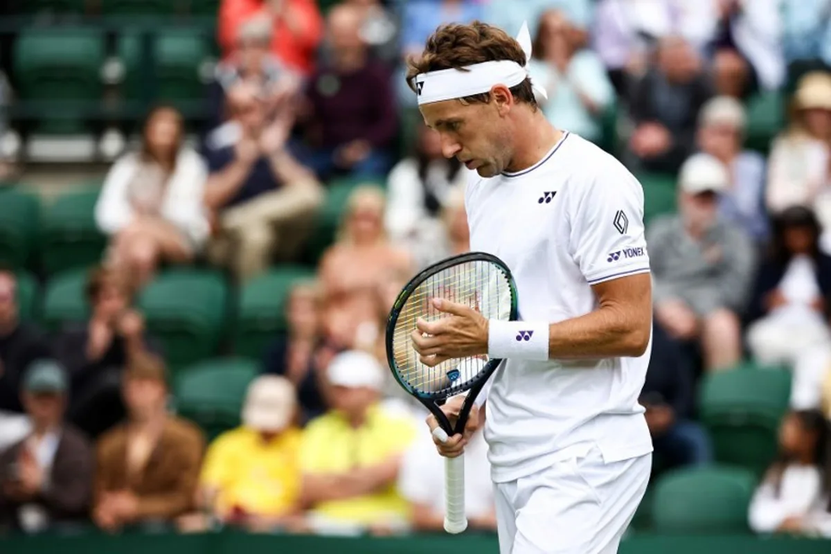 Norway's Casper Ruud reacts as he plays against Australia's Alex Bolt during their men's singles tennis match on the first day of the 2024 Wimbledon Championships at The All England Lawn Tennis and Croquet Club in Wimbledon, southwest London, on July 1, 2024. HENRY NICHOLLS / AFP