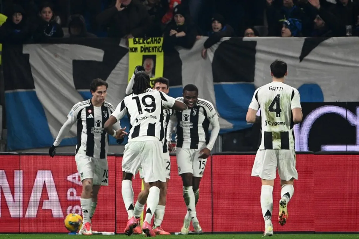 Juventus' French defender #15 Pierre Kalulu celebrates with teammates after scoring his team's first goal during the Italian Serie A football match between Atalanta and Juventus at the Gewiss Stadium in Bergamo, on January 14, 2025.  Isabella BONOTTO / AFP