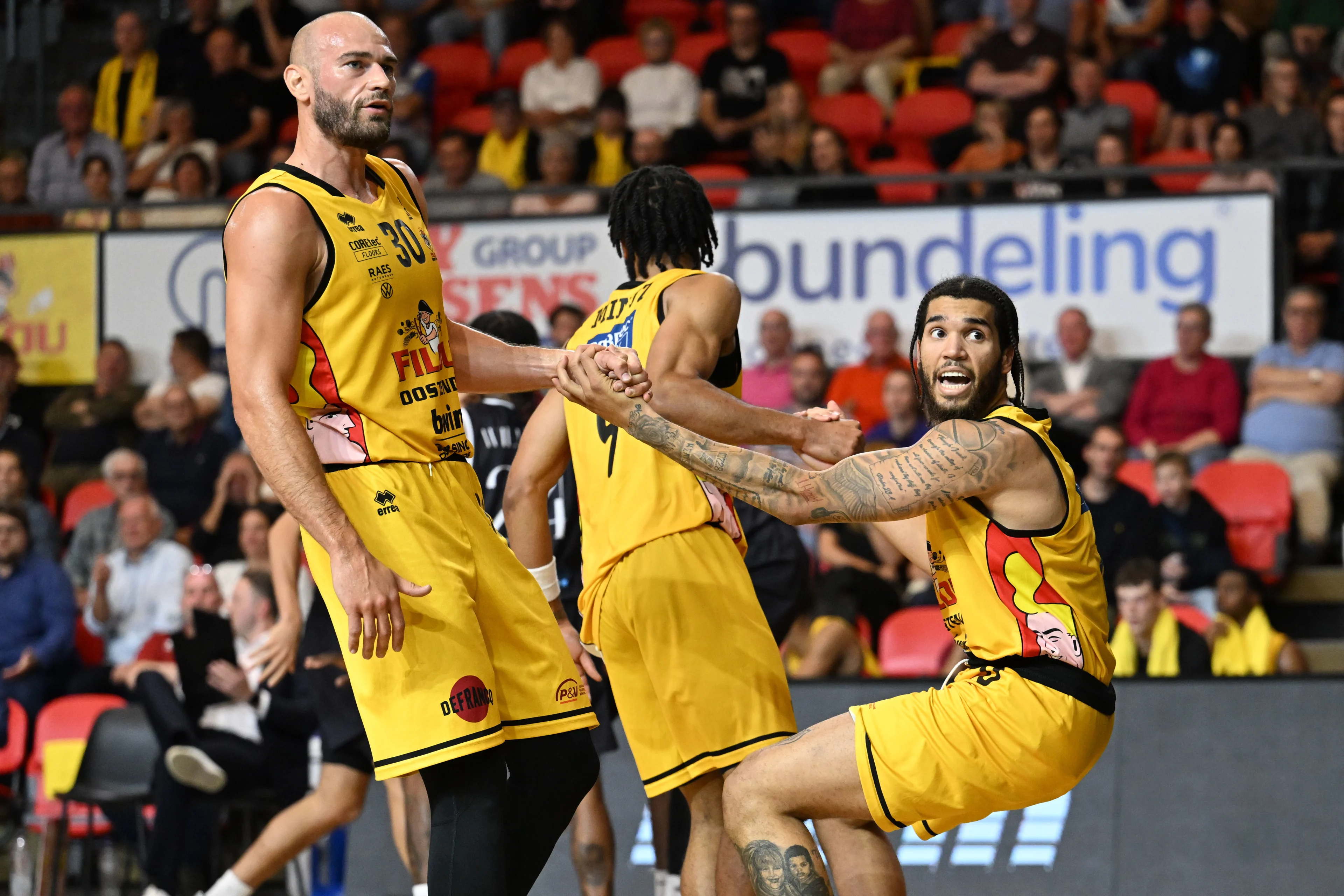 Oostende's Pierre-Antoine Gillet and Oostende's Timmy Allen pictured during a basketball match between BC Oostende and Spirou Charleroi, Saturday 14 September 2024 in Oostende, on day 1 of the 'BNXT League' Belgian/ Dutch first division basket championship. BELGA PHOTO MAARTEN STRAETEMANS