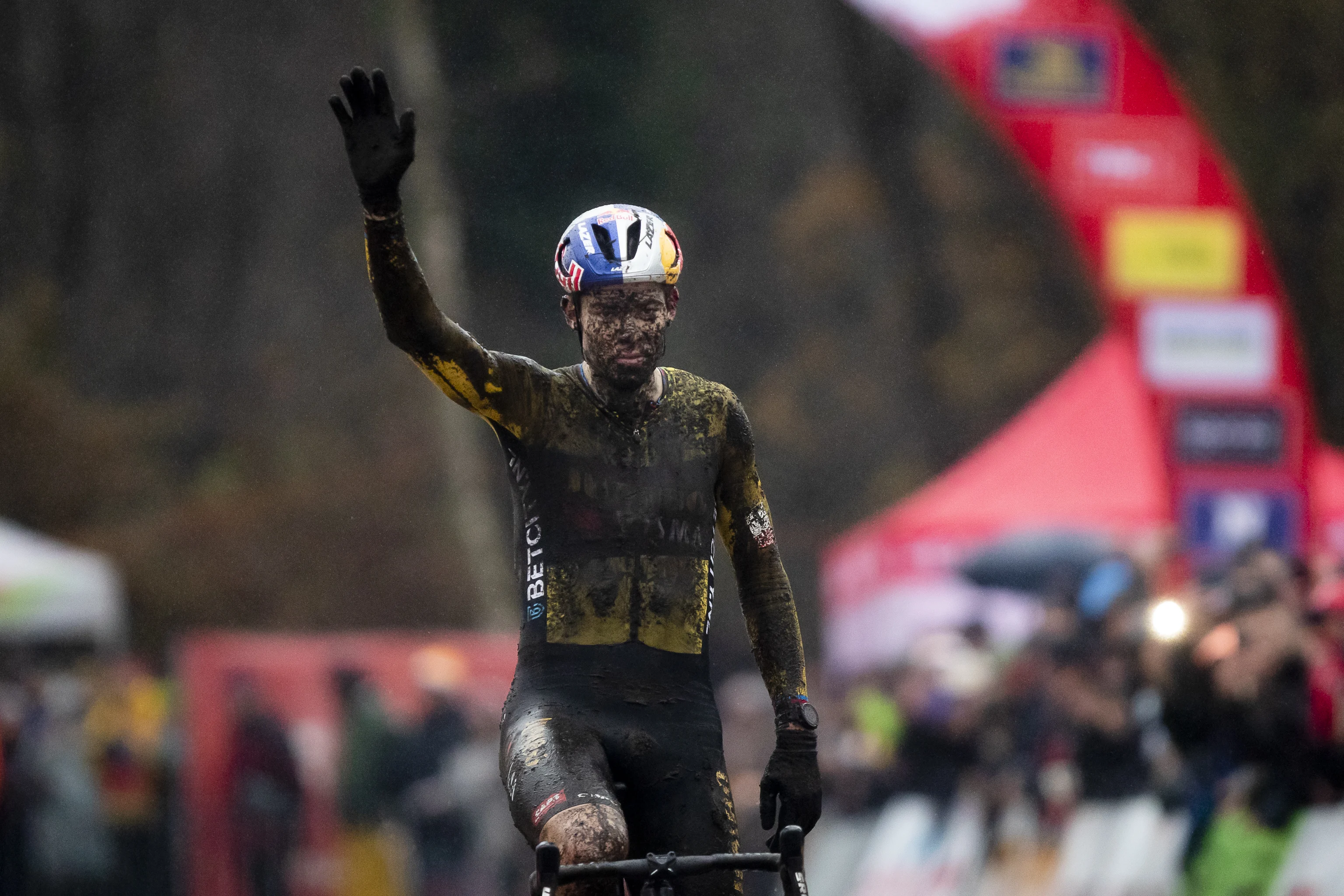 Belgian Wout van Aert celebrates after winning the men's elite race of the Exact Cross Essen, stage 2 (out of 6) in the Exact Cross cyclocross competition, Saturday 09 December 2023, in Essen. BELGA PHOTO KRISTOF VAN ACCOM