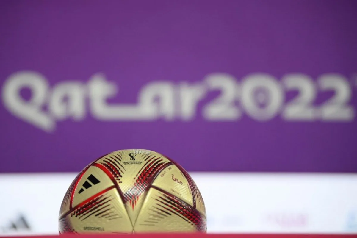 The "Al Hilm" ball, the official match ball which will be used in the Qatar 2022 World Cup football semi-finals and final, is displayed during a press conference in Doha on December 13, 2022.  FRANCK FIFE / AFP