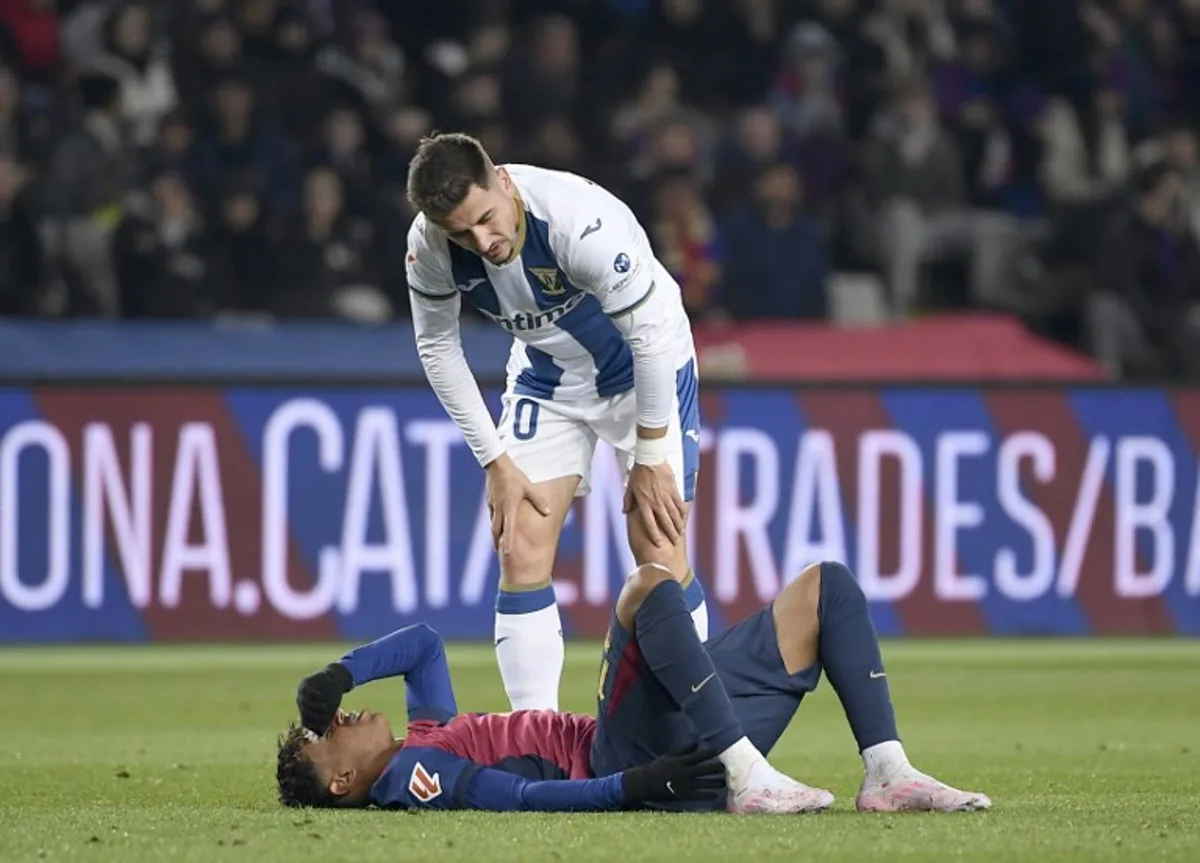 Barcelona's Spanish forward #19 Lamine Yamal reacts on the ground during the Spanish league football match between FC Barcelona and Club Deportivo Leganes SAD at the Estadi Olimpic Lluis Companys in Barcelona on December 15, 2024.  Josep LAGO / AFP