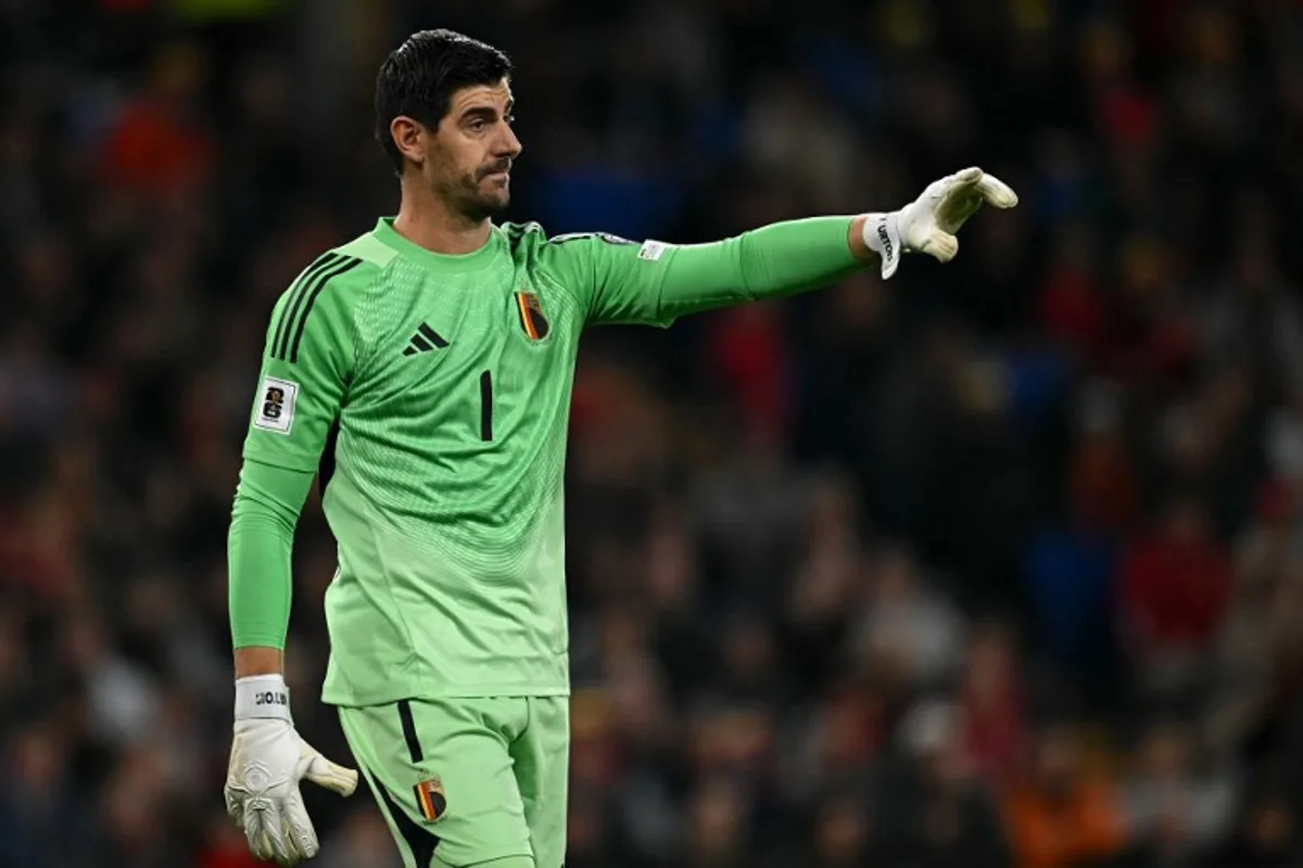 Belgium's goalkeeper #01 Thibaut Courtois shouts instructions to team mates during the 2026 World Cup Group J qualifier football match between Wales and Belgium, at Cardiff City Stadium, in Cardiff, on October 13, 2025. Paul ELLIS / AFP