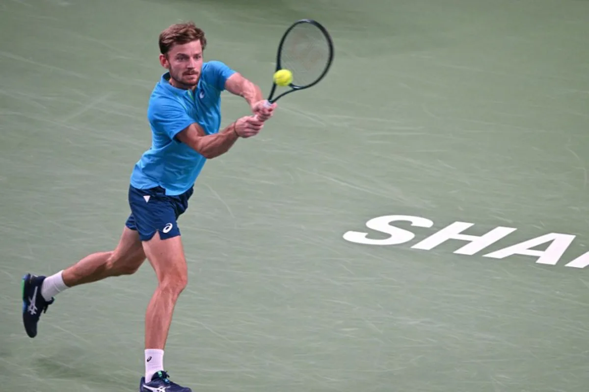 Belgium's David Goffin hits a return to Germany's Alexander Zverev during their men's singles match at the Shanghai Masters tennis tournament in Shanghai on October 9, 2024.  HECTOR RETAMAL / AFP