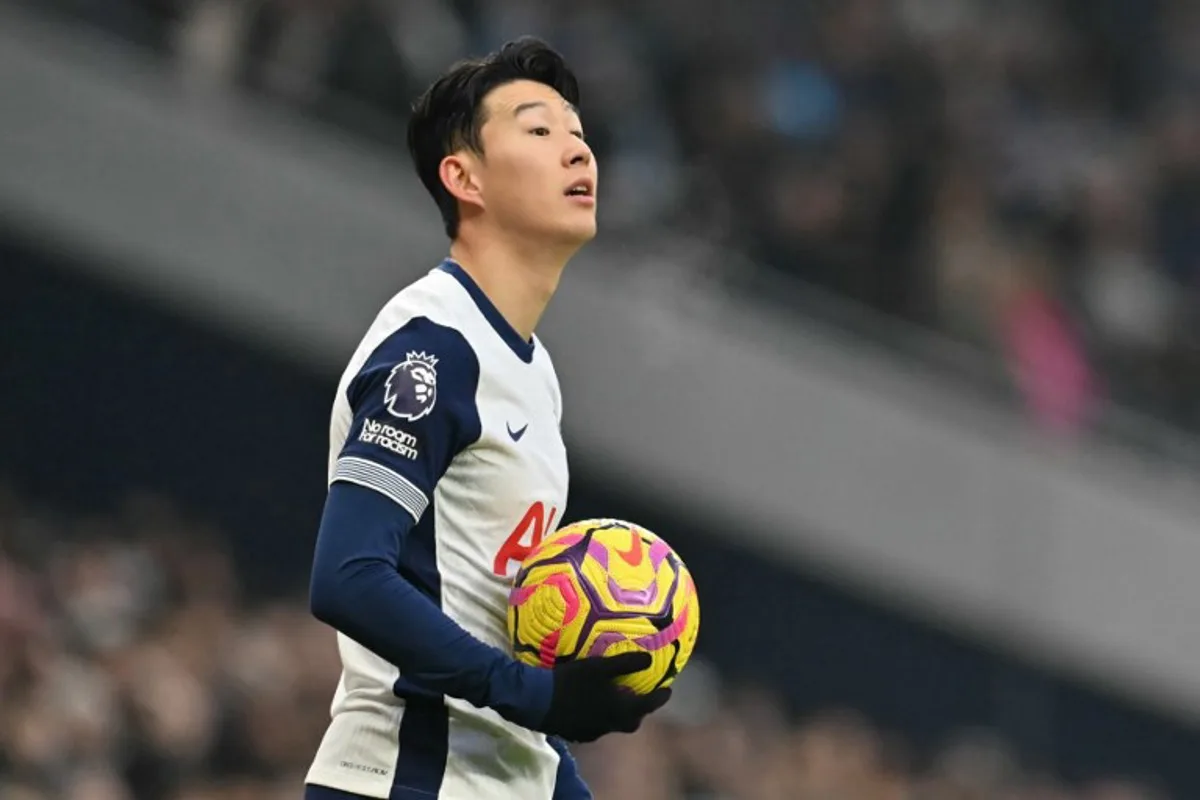 Tottenham Hotspur's South Korean striker #07 Son Heung-Min prepares to a take a throw-in during the English Premier League football match between Tottenham Hotspur and Wolverhampton Wanderers at the Tottenham Hotspur Stadium in London, on December 29, 2024.  Glyn KIRK / AFP