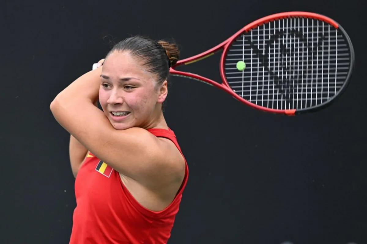 Belgium's Sofia Costoulas hits a return to China's Wang Xiyu during their women's singles match at the Billie Jean King Cup tennis play-offs at the Guangzhou Nansha International Tennis Center in Guangzhou, in south China's Guangdong province on November 17, 2024.  STR / AFP