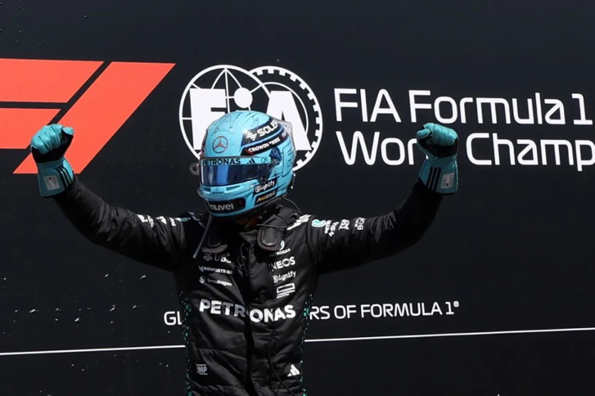 Mercedes' British driver George Russell celebrates after winning the 2025 Formula 1 Grand Prix du Canada at Circuit Gilles-Villeneuve in Montreal, Canada, on June 15, 2025. TIMOTHY A. CLARY / AFP