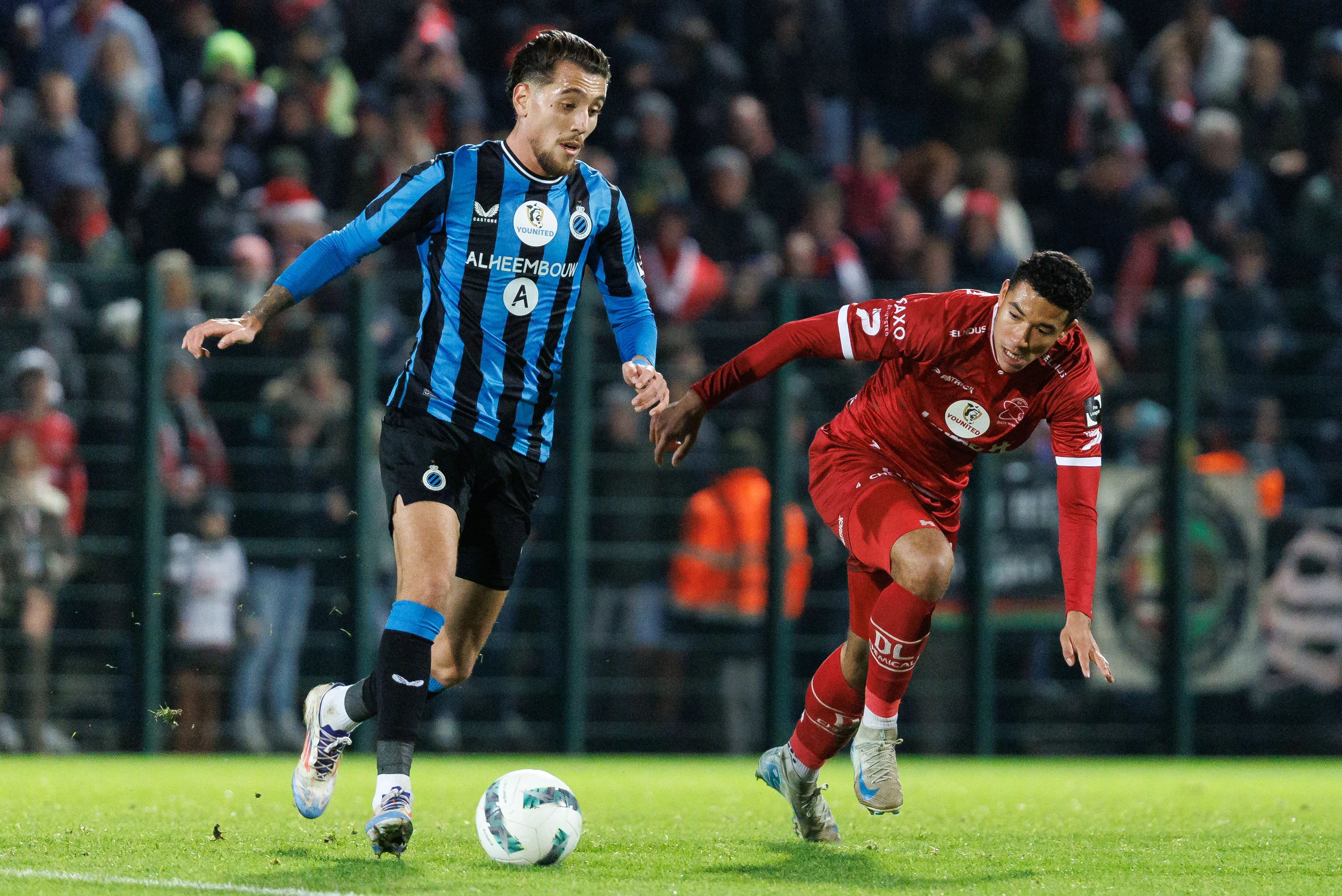 Club's Daniel Perez and Essevee's Laurent Lemoine fight for the ball during a soccer match between Club NXT and SV Zulte Waregem, in Roeselare, on day 16 of the 2024-2025 'Challenger Pro League' 1B second division of the Belgian championship, Friday 20 December 2024. BELGA PHOTO KURT DESPLENTER