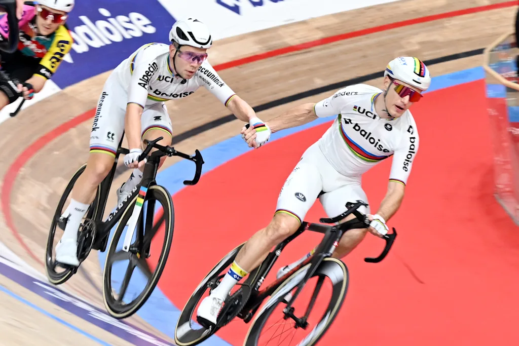 Belgian Fabio Van Den Bossche and Belgian Lindsay De Vylder pictured in action during the last day of the Zesdaagse Vlaanderen-Gent six-day indoor track cycling event at the indoor cycling arena 't Kuipke, Sunday 23 November 2025, in Gent. BELGA PHOTO MAARTEN STRAETEMANS