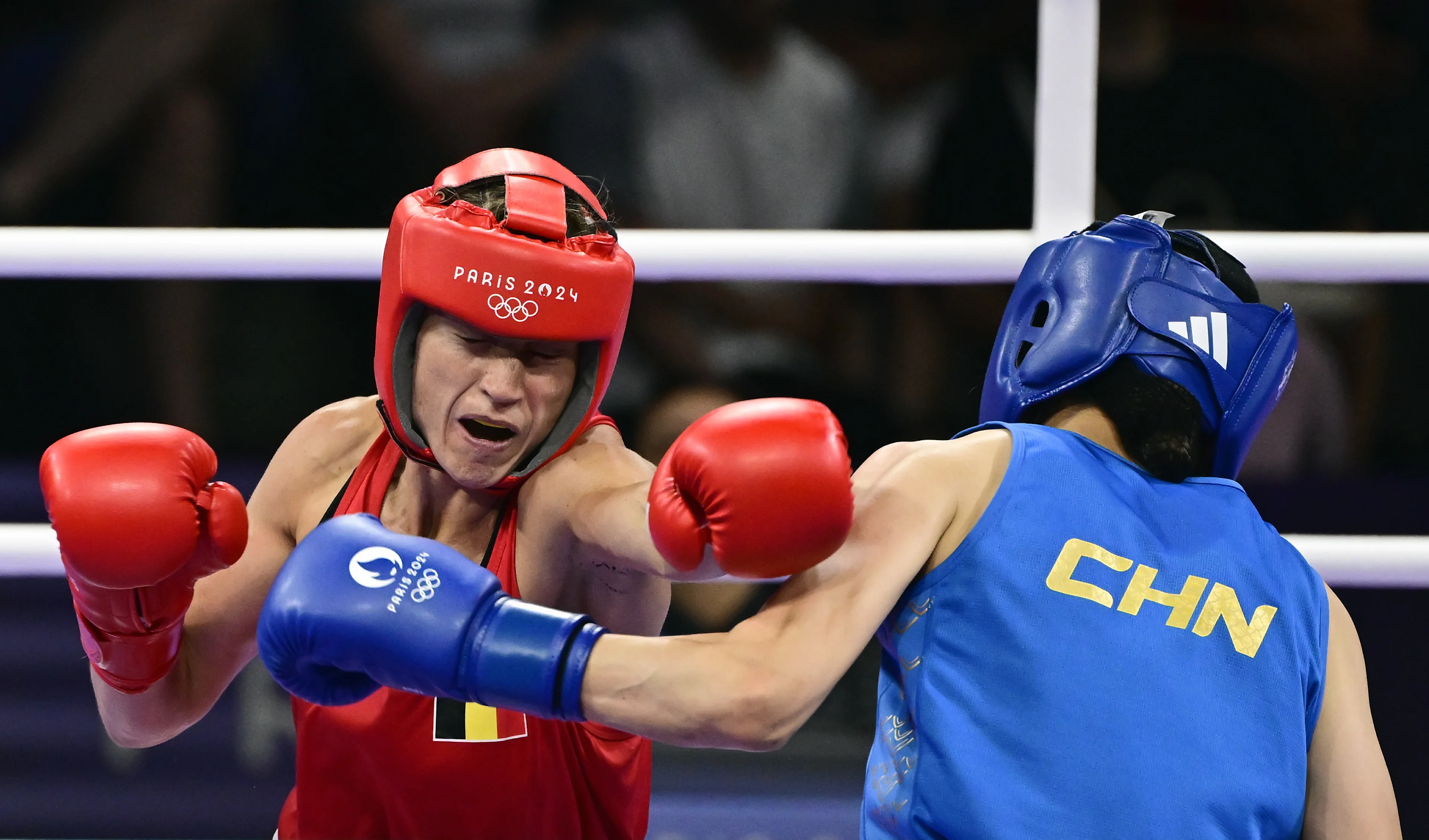 Chinese boxer Liu Yang (blue) and Belgian boxer Oshin Derieuw (red) pictured in action during a boxing bout between Belgian Derieuw and Chinese Yang, in the quarterfinal of the women's -66kg category at the Paris 2024 Olympic Games, on Saturday 03 August 2024 in Paris, France. The Games of the XXXIII Olympiad are taking place in Paris from 26 July to 11 August. The Belgian delegation counts 165 athletes competing in 21 sports. BELGA PHOTO DIRK WAEM