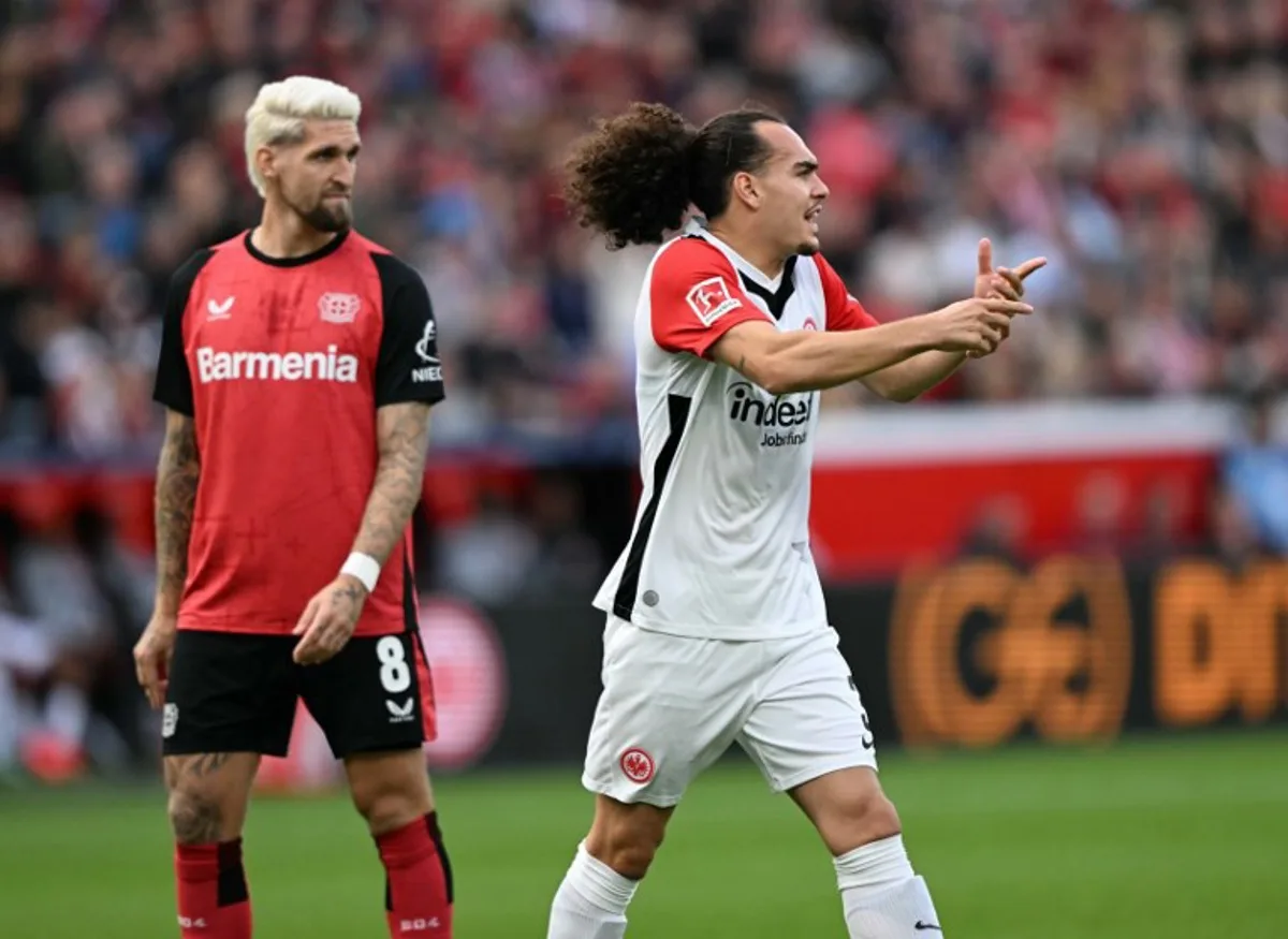 Frankfurt's Belgian defender #03 Arthur Theate reacts during the German first division Bundesliga football match between XBayer Leverkusen and Eintracht Frankfurt in Leverkusen on October 19, 2024.  INA FASSBENDER / AFP