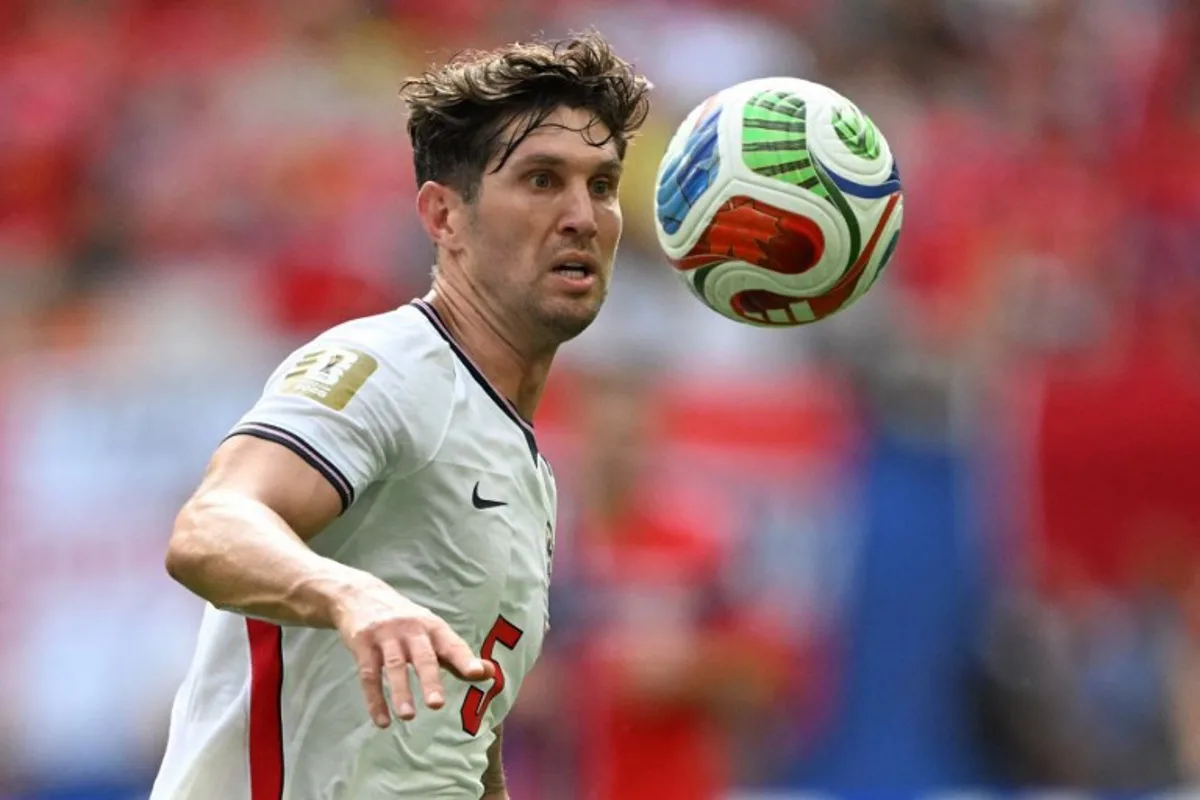 England's defender #05 John Stones looks at the ball during the 2026 World Cup football tournament quarter-final match between Norway and England at Miami Stadium in Miami Gardens on July 11, 2026.   MAURO PIMENTEL / AFP