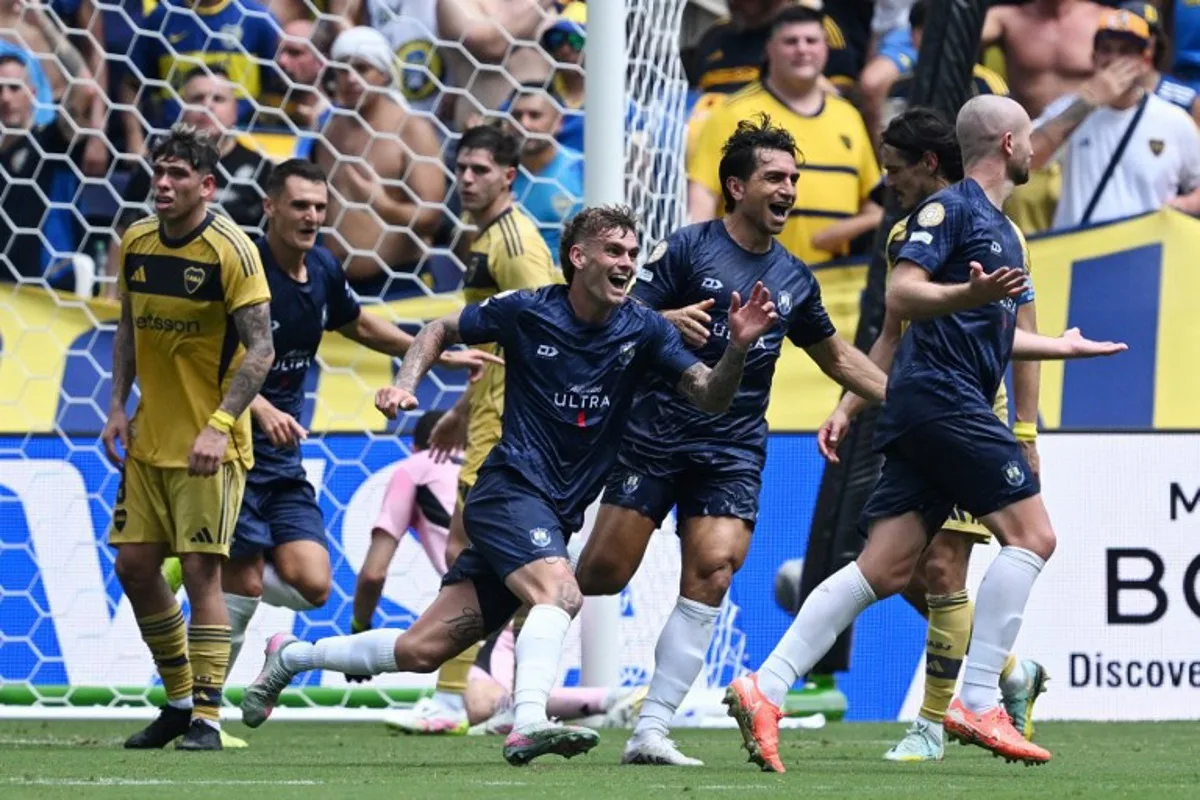 Auckland City's New Zealander defender #04 Christian Gray (R) celebrates scoring his team's first goal during the FIFA Club World Cup 2025 Group C football match between New Zealand's Auckland City and Argentina's Boca Juniors at the Geodis Park stadium in Nashville on June 24, 2025. Federico PARRA / AFP