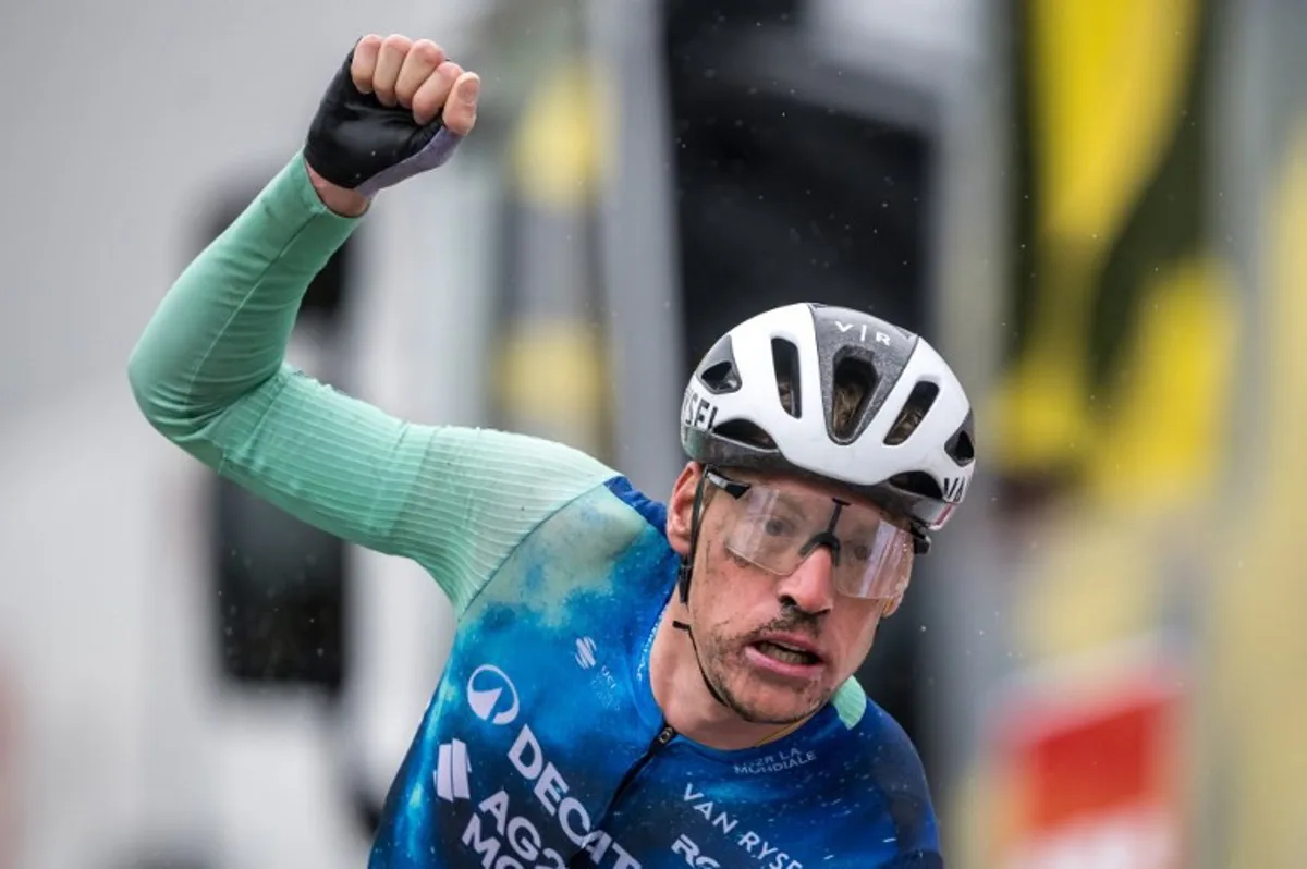 Team Decathlon AG2R La Mondiale's Team French rides Dorian Godon (Far R) sprint to win the finish line during the fifth and final stage of the Tour of Romandy UCI cycling World tour, 150.8 km starting and finishing in Vernier near Geneva, on April 28, 2024.  Fabrice COFFRINI / AFP