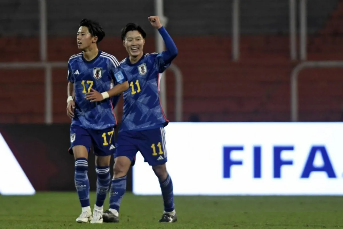 Japan's forward Isa Sakamoto (R) celebrates next to teammate Japan's midfielder Kosuke Matsumura after scoring his team's first goal during the Argentina 2023 U20 World Cup group C football match between Japan and Israel, at Malvinas Argentinas stadium in Mendoza, Argentina, on May 27, 2023.  Andres Larrovere / AFP