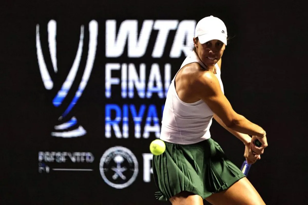US' Madison Keys returns the ball to US' Amanda Anisimova during their tennis match at the WTA Finals in Riyadh on November 3, 2025. Fayez NURELDINE / AFP