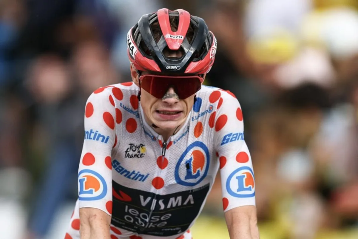 Team Visma | Lease a Bike's Danish rider Jonas Vingegaard wearing the climber's dotted "King of the Mountains" jersey cycles to the finish of the 14th stage of the 113th edition of the Tour de France cycling race, 155,3 km between Mulhouse and Le Markstein in the Vosges mountains, on July 18, 2026. Anne-Christine POUJOULAT / AFP