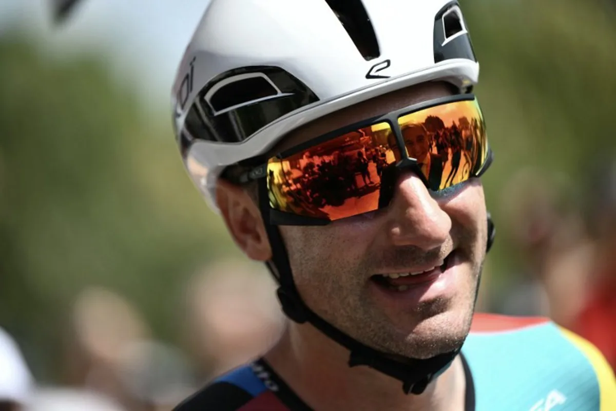 Team Lotto's Italian rider Elia Viviani arrives to compete in the first stage of the Vuelta a Espana, a 183 km race between Torino - Reggia di Venaria and Novara, in Italy's Piemonte region, on August 23, 2025. Marco BERTORELLO / AFP
