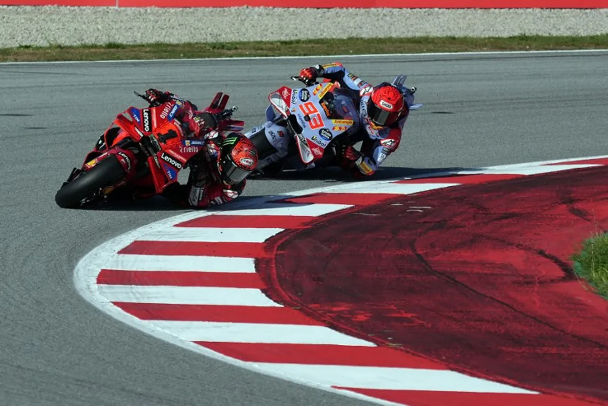 Ducati Italian rider Francesco Bagnaia (L) rides ahead of Ducati Spanish rider Marc Marquez during the Moto GP qualifying session of the Solidarity Grand Prix of Barcelona at the Circuit de Catalunya on November 16, 2024 in Montmelo on the outskirts of Barcelona.  Manaure Quintero / AFP