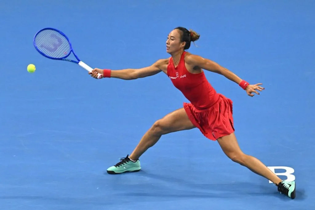 China's Zheng Qinwen hits a return to Russia's Mirra  Andreeva during their women's singles quarter-final at the China Open tennis tournament in Beijing on October 11, 2026.  Greg Baker / AFP