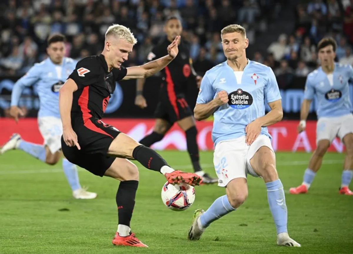 (FILES) Barcelona's Spanish forward #20 Daniel Olmo fights for the ball with Celta Vigo's Swedish defender #02 Carl Starfelt during the Spanish league football match between RC Celta de Vigo and FC Barcelona at the Balaidos stadium in Vigo on November 23, 2024. Barcelona took their desperate attempts to register Dani Olmo to Spain's High Council for Sports on January 4, 2025 after La Liga and the national federation pushed their star playmaker closer to a potentially embarrassing departure, AFP reports. MIGUEL RIOPA / AFP