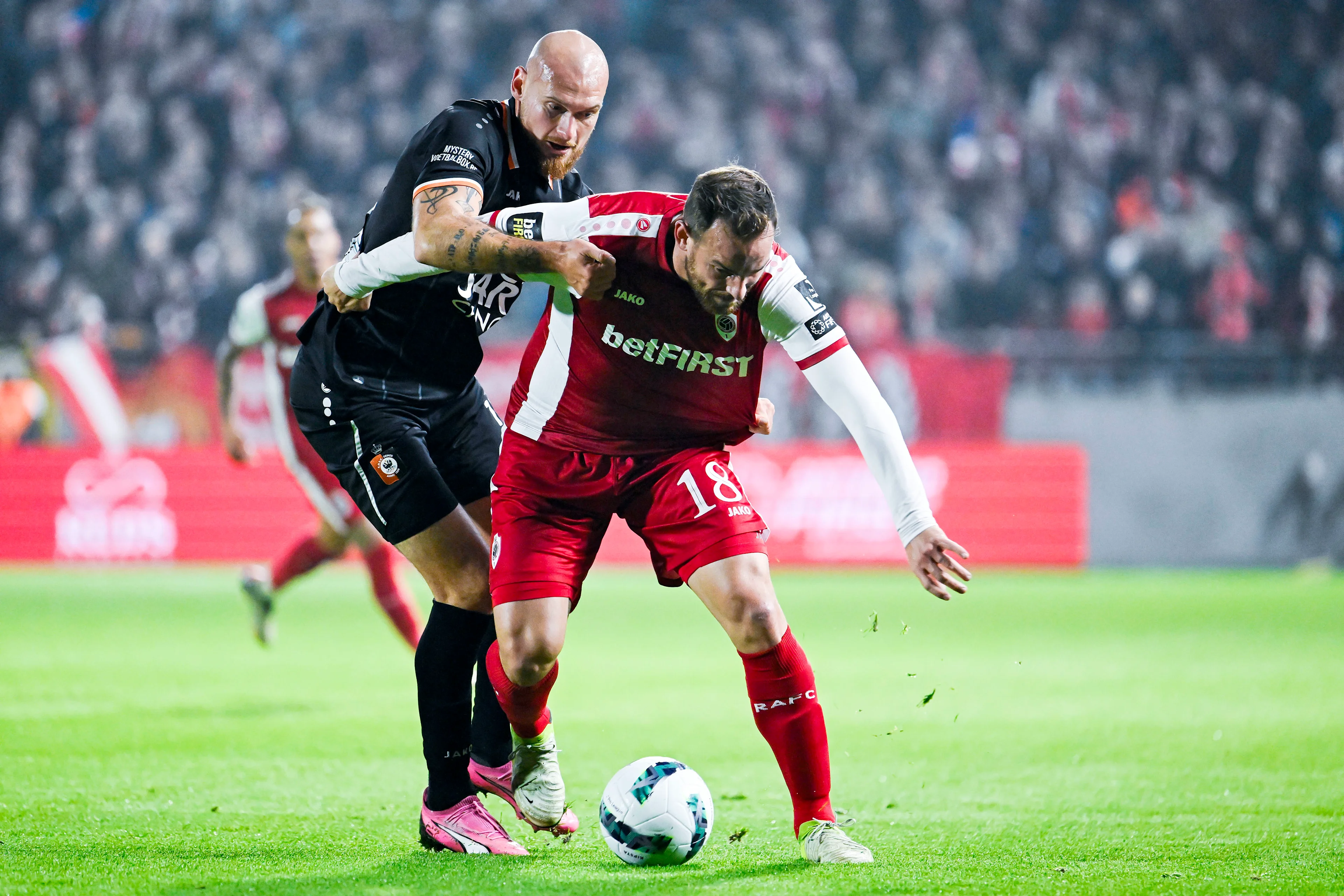 Deinze's Denis Prychynenko and Antwerp's Vincent Janssen pictured in action during a soccer game between JPL club Royal Antwerp and second division club KMSK Deinze, Thursday 31 October 2024 in Deurne, in the round 1 of 16 of the 'Croky Cup' Belgian soccer cup. BELGA PHOTO TOM GOYVAERTS