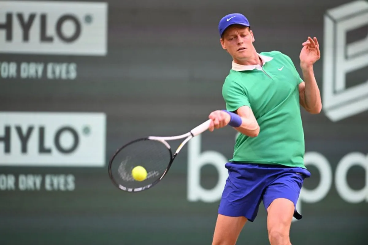 Kazakhstan's Alexander Bublik plays the ball to Italy's Jannik Sinner in their men's singles tennis match during the Halle Open ATP tennis tournament in Halle, on June 19, 2025. CARMEN JASPERSEN / AFP