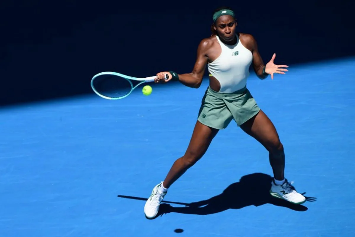 USA's Coco Gauff hits a return against Spain's Paula Badosa during their women's singles match on day ten of the Australian Open tennis tournament in Melbourne on January 21, 2025.  Yuichi YAMAZAKI / AFP