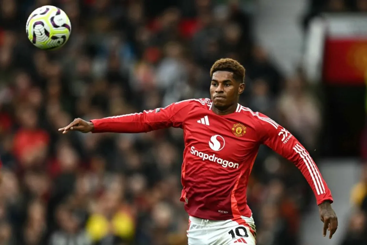 Manchester United's English striker #10 Marcus Rashford focuses on the ball during the English Premier League football match between Manchester United and Tottenham Hotspur at Old Trafford in Manchester, north west England, on September 29, 2024.  Paul ELLIS / AFP